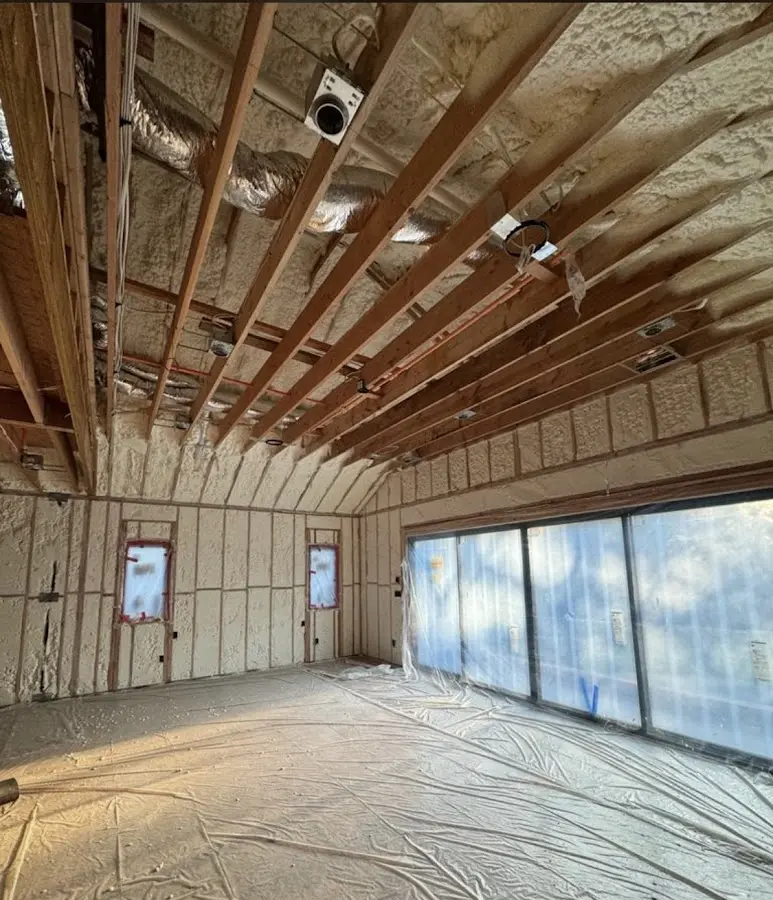 Interior walls and ceiling insulated with spray foam during new construction in Gainesville
